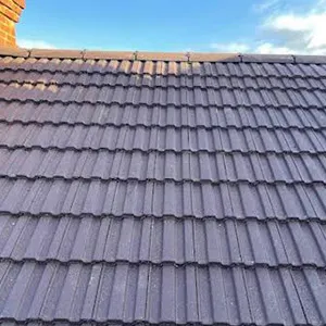 the roof of a house with a blue sky in the background