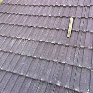 a yellow fire hydrant sitting on top of a roof