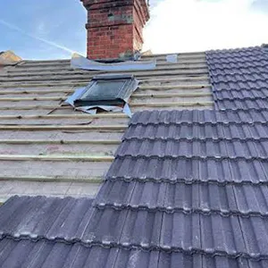 the roof of a house with a broken gutter