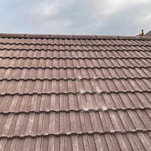 the roof of a building with a clock on it